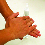 Photo of person lathering soap on their hands