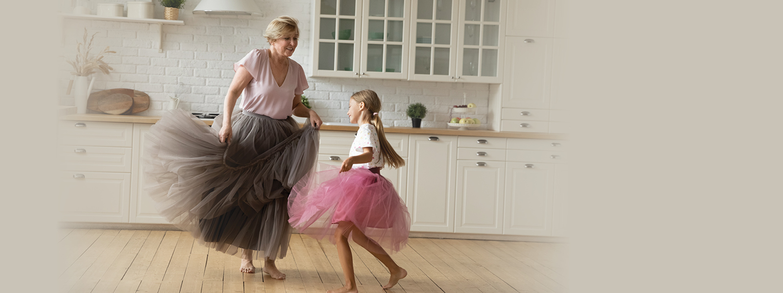 Photo of grandmother and granddaughter dancing