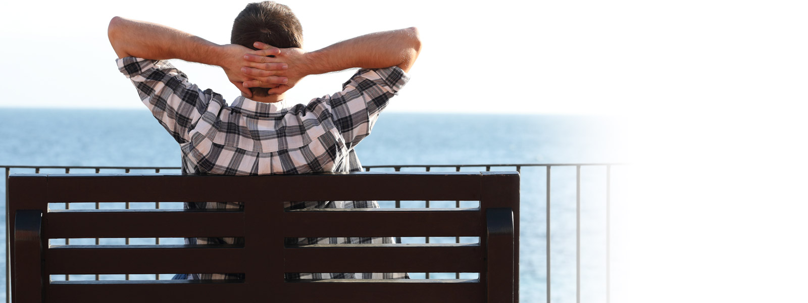 Photo of a man relaxing on a bench