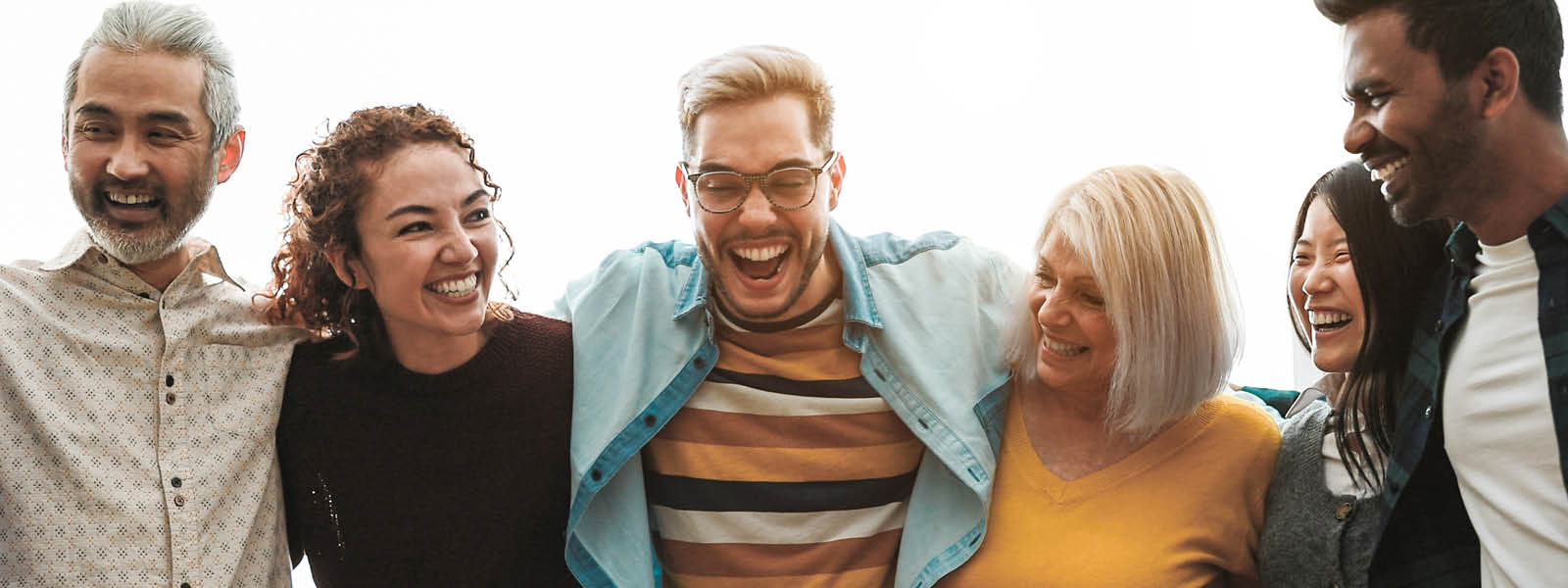 Photo of a group of people smiling and laughing