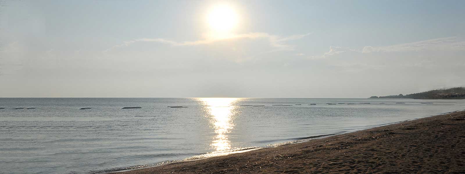 Image of beach with sun setting
