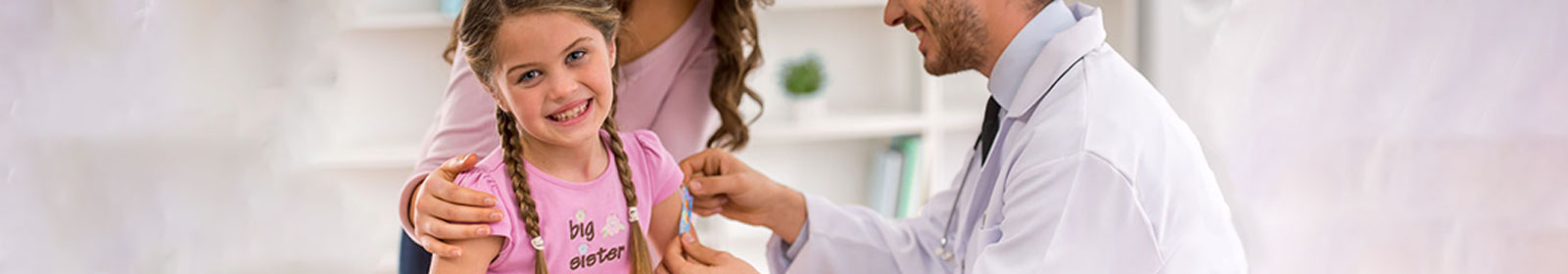 Doctor giving a child an vaccine shot