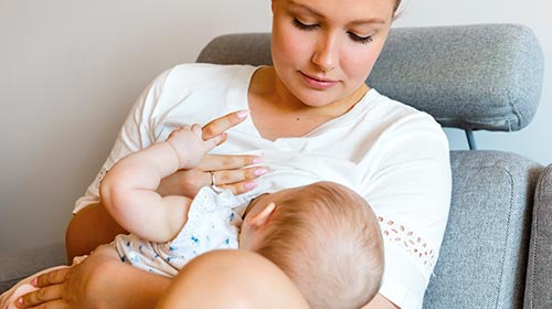 Photo of woman breastfeeding a baby