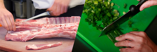 A picture of  two cutting boards being used. One for cutting raw meat and the other for vegetables.