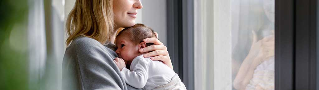 mother holding her new born baby