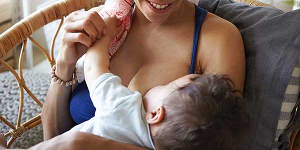 photo of mother breastfeeding her baby