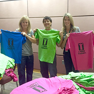 Nurses holding "I peed today" t-shirts