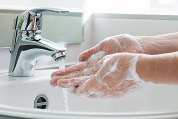 Photo of a person washing their hands