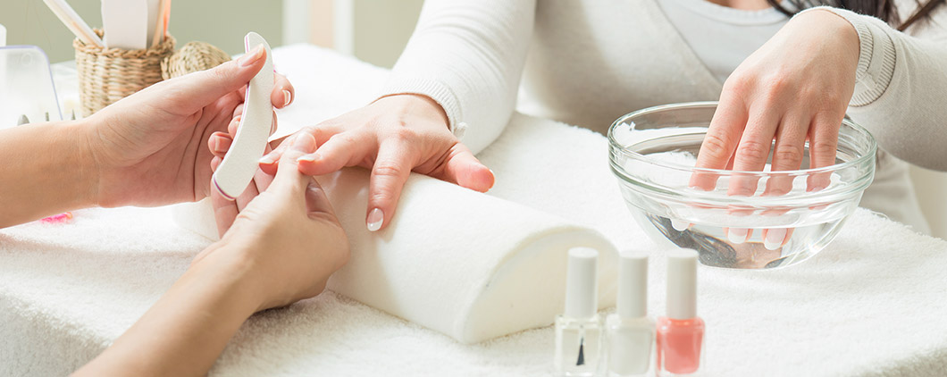 Photo of person receiving a manicure