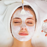 Photo of a woman getting a facial treatment