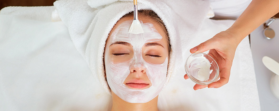 Photo of woman receiving facial treatment