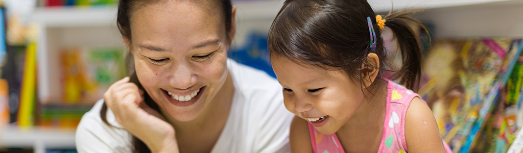 Mother and daughter reading a book