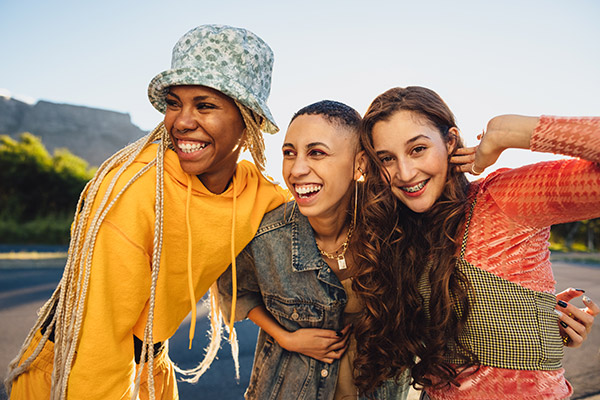 3 young women smiling together