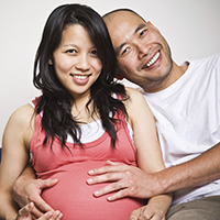 A pregnant couple.
