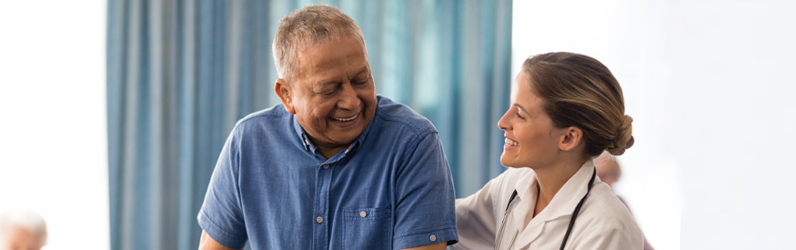 nurse helping an older man