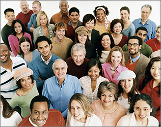 A large diverse group of people looking up and smiling.